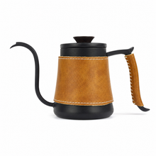 Black gooseneck kettle with a brown leather body sleeve and handle wrap