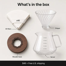 What's in the box: 40 filters, glass dripper, wooden base and faceted glass server