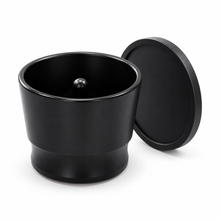 Black aluminum espresso dosing cup with matching lid, on white background