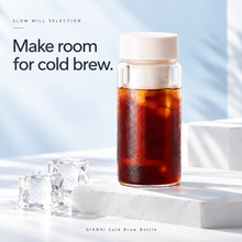 Cold brew coffee bottle on a light blue background