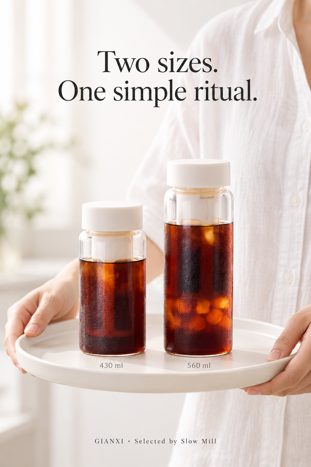 Two cold brew bottle sizes in a bright home setting