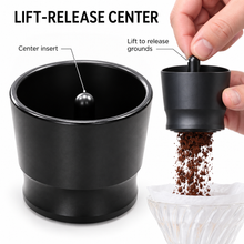 Close-up of espresso dosing cup center insert and lift-to-release motion