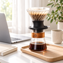 A coffee break at a bright home office desk with the wood-collar brewing set