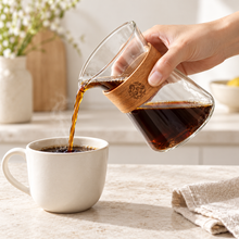 Pouring coffee from the 400 ml wood-collar glass server
