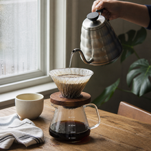 Slow Mill glass cone dripper used for pour-over coffee